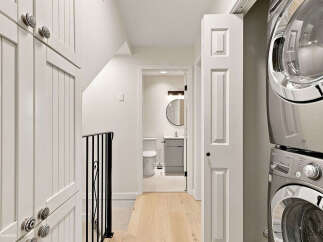Discover convenient living with this stacked washer and dryer unit, perfect for maximizing space in your home.