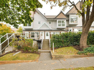 Discover modern living in this multi-level townhouse featuring a light-filled interior and elegant bay windows.