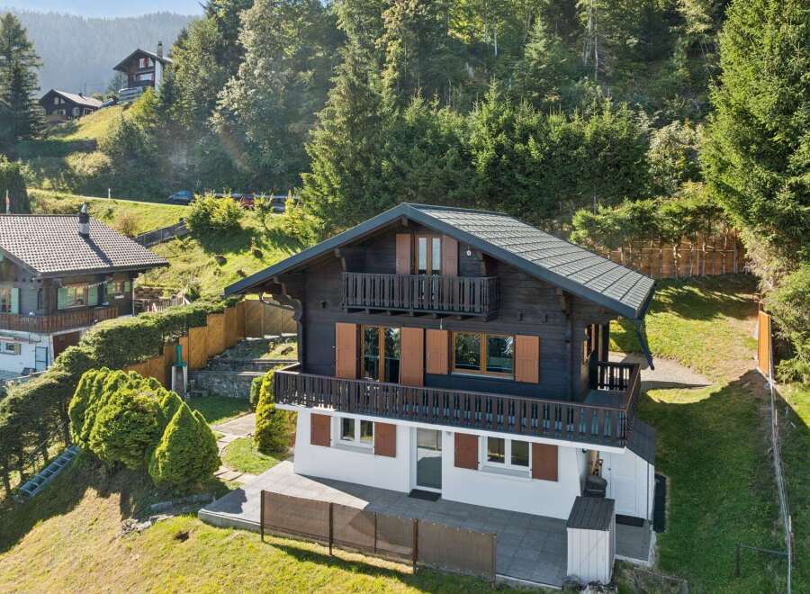 Nestled amidst lush greenery and rolling hills, this charming chalet offers a serene mountain retreat.