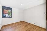 Discover this bright and airy room featuring a modern aesthetic with clean white walls and a beautiful hardwood floor.