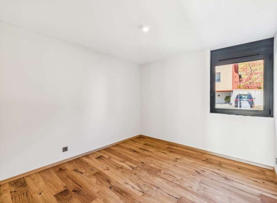 Discover this bright and airy room featuring beautiful hardwood floors that add warmth and character.