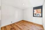 Discover this bright and airy room featuring beautiful hardwood floors that add warmth and character.