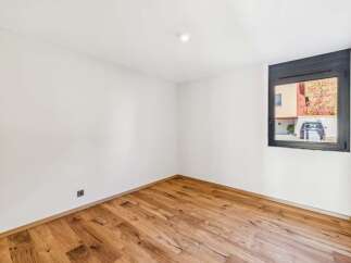 Discover this bright and airy room featuring beautiful hardwood floors that add warmth and character.