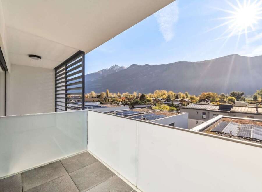 Enjoy breathtaking mountain views from this modern balcony, perfect for relaxing or entertaining.