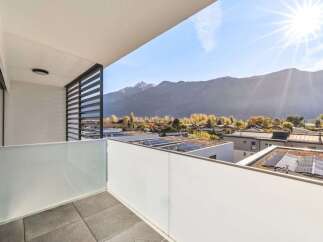 Enjoy breathtaking mountain views from this modern balcony, perfect for relaxing or entertaining.