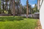 Enjoy the expansive, beautifully manicured lawn in this spacious backyard, perfect for outdoor activities and relaxation.