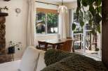 Enjoy cozy meals in this charming dining area, featuring a warm wooden table and comfortable seating.