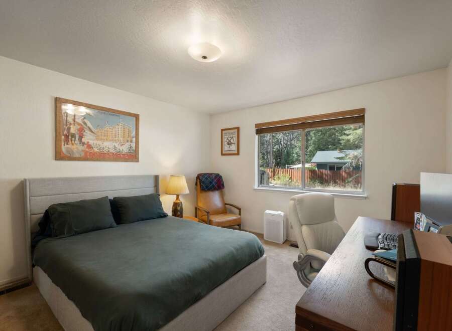 This charming bedroom offers a comfortable queen-size bed with plush bedding, perfect for restful nights.