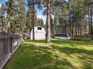 Enjoy the expansive backyard of this property, complete with a large, well-maintained lawn perfect for outdoor activities and relaxation.