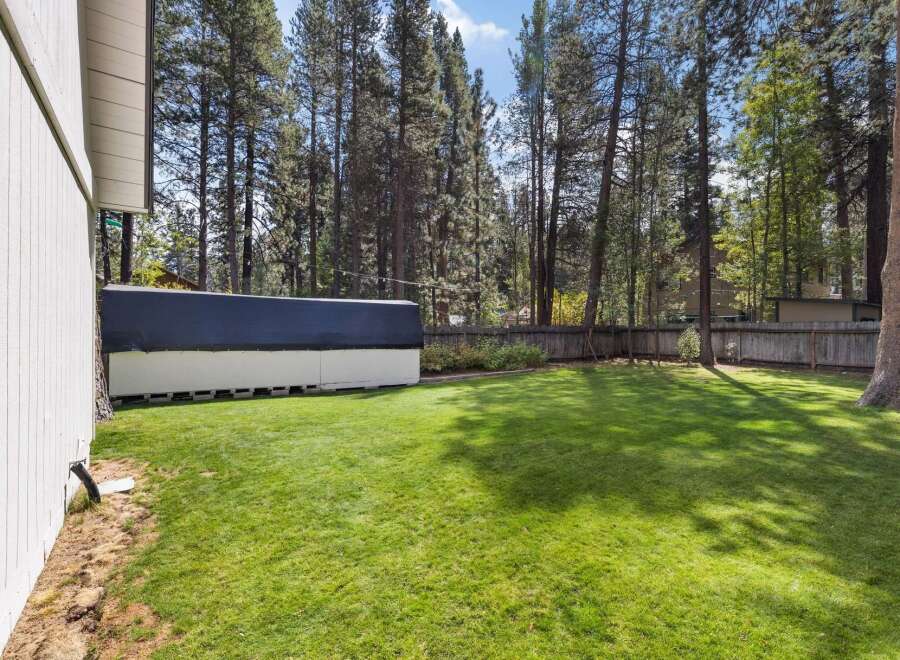 Enjoy the spacious backyard of this property, perfect for outdoor activities and relaxation.