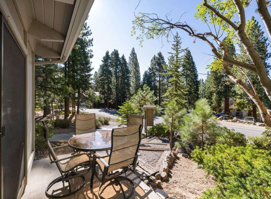 Enjoy your morning coffee or evening drinks on this charming patio, complete with a glass-top table and four comfortable chairs.