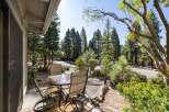 Enjoy your morning coffee or evening drinks on this charming patio, complete with a glass-top table and four comfortable chairs.