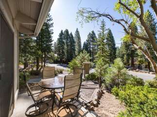 Enjoy your morning coffee or evening drinks on this charming patio, complete with a glass-top table and four comfortable chairs.