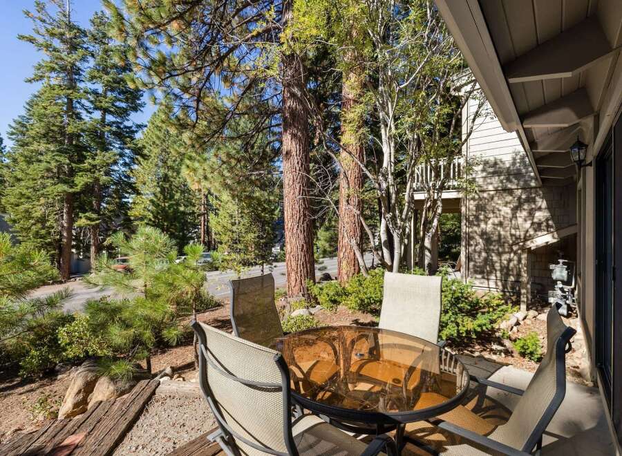 Enjoy your morning coffee or evening drinks on this charming patio, complete with a glass-top table and four chairs.