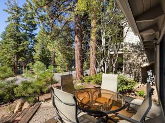 Enjoy your morning coffee or evening drinks on this charming patio, complete with a glass-top table and four chairs.