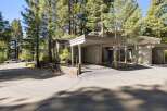 Discover this charming home nestled among mature pine trees, offering a serene and private setting.