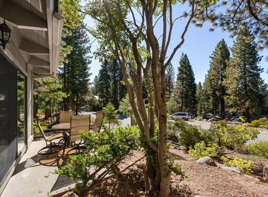 Enjoy outdoor living on this charming patio, complete with a dining set perfect for al fresco meals.