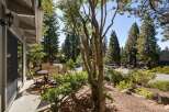 Enjoy outdoor living on this charming patio, complete with a dining set perfect for al fresco meals.