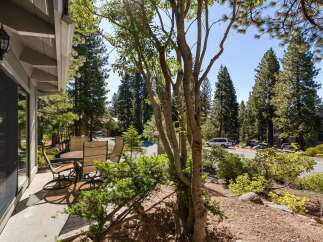 Enjoy outdoor living on this charming patio, complete with a dining set perfect for al fresco meals.