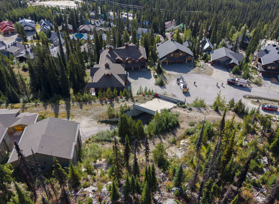Discover luxury mountain living in this stunning property nestled amidst a serene forest landscape.