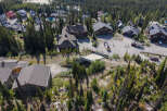 Discover luxury mountain living in this stunning property nestled amidst a serene forest landscape.