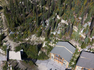 Experience mountain living in this stunning property nestled amidst a lush forest.