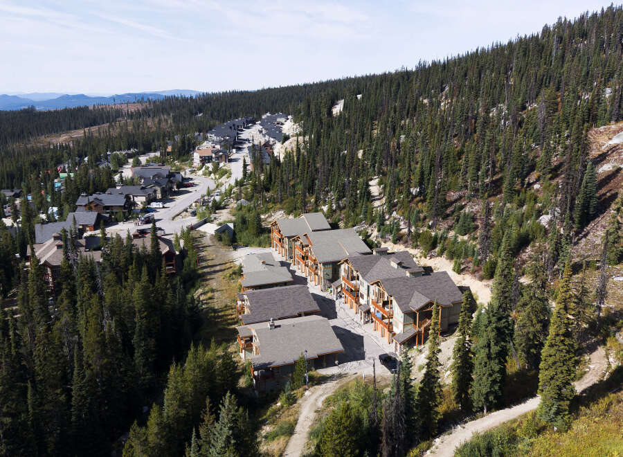 Discover this stunning mountain property nestled amidst a dense evergreen forest, offering breathtaking natural beauty and serene surroundings.