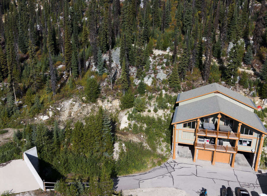 Experience mountain living in this stunning property nestled amidst a dense forest.