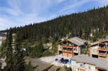 Experience mountain living in this stunning property nestled amidst a dense evergreen forest.