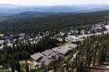 Discover this stunning mountain retreat nestled amidst a dense evergreen forest, offering breathtaking panoramic views.