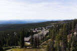 Discover luxury mountain living in this stunning property nestled amidst a dense evergreen forest.