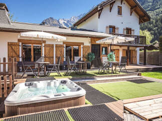 Experience ultimate relaxation in this stunning property featuring a luxurious hot tub perfect for unwinding after a day of adventure.