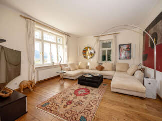 Experience luxurious living in this beautifully appointed living room, featuring a spacious sectional sofa perfect for relaxation and entertaining.