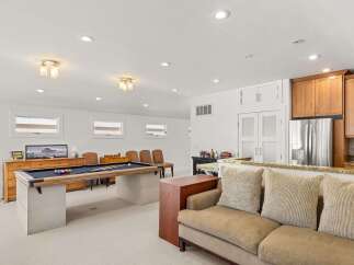 This spacious basement features a full-size pool table, perfect for entertaining guests or enjoying a night in.