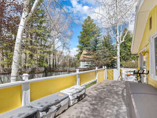 Enjoy outdoor living on this spacious deck, perfect for relaxation and entertaining.