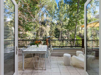 Enjoy the serene mountain views from this charming patio, perfect for al fresco dining or relaxing with a morning coffee.