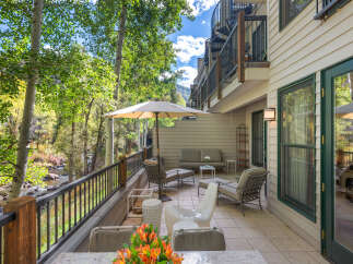 Enjoy breathtaking mountain and river views from this stunning patio, perfect for outdoor entertaining.