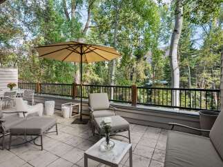 Enjoy the serene mountain views from this spacious outdoor patio, perfect for al fresco dining or relaxing with a book.