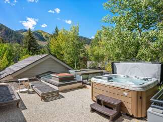 Experience ultimate relaxation with this luxurious hot tub, perfect for unwinding amidst stunning mountain views.