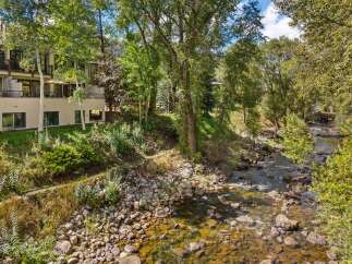Experience luxurious living with this stunning property nestled beside a serene river.
