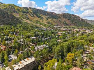 Experience the charm of this picturesque mountain town, nestled amidst lush greenery and towering peaks.