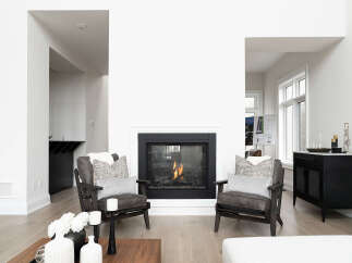 Experience modern living in this stunning home featuring a cozy fireplace as the centerpiece of the living area.
