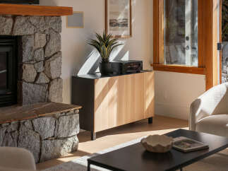 Experience cozy living with this inviting fireplace, perfect for gathering on chilly evenings.