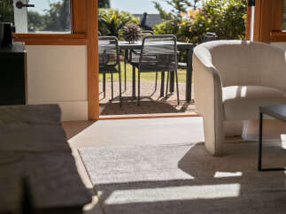 Step into a beautifully designed living space that seamlessly blends indoor comfort with outdoor tranquility.