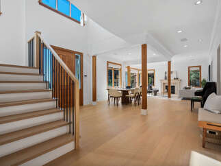 Experience modern living in this spacious open-concept home featuring a grand staircase and abundant natural light.