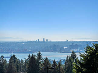 Experience breathtaking panoramic views of the Vancouver skyline and harbor from this exceptional property.