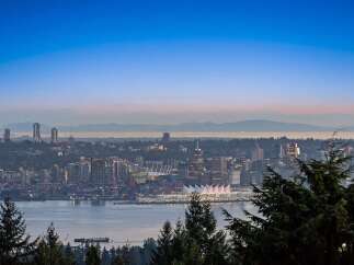 Experience breathtaking panoramic views of the Vancouver skyline and surrounding mountains from this exceptional property.