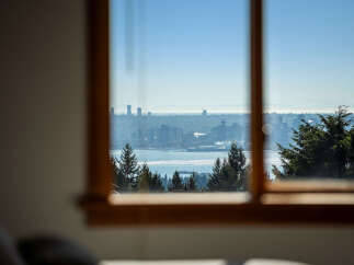 Experience breathtaking panoramic views of the city skyline and sparkling water from this stunning property.