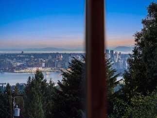 Experience breathtaking panoramic views of the Vancouver skyline and surrounding mountains from this exceptional property.