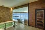 Experience ultimate relaxation in this luxurious spa featuring a soothing jacuzzi and a private sauna, perfect for unwinding.